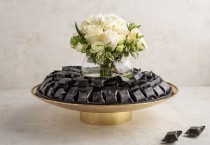 Wrapped Black pralines in Gold tray & flower