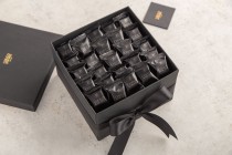 Wrapped Black pralines-square box small with flower bouquet