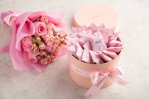 Wrapped Pink pralines -small gift box with flower bouquet