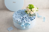Blue chocolate gift box with flower